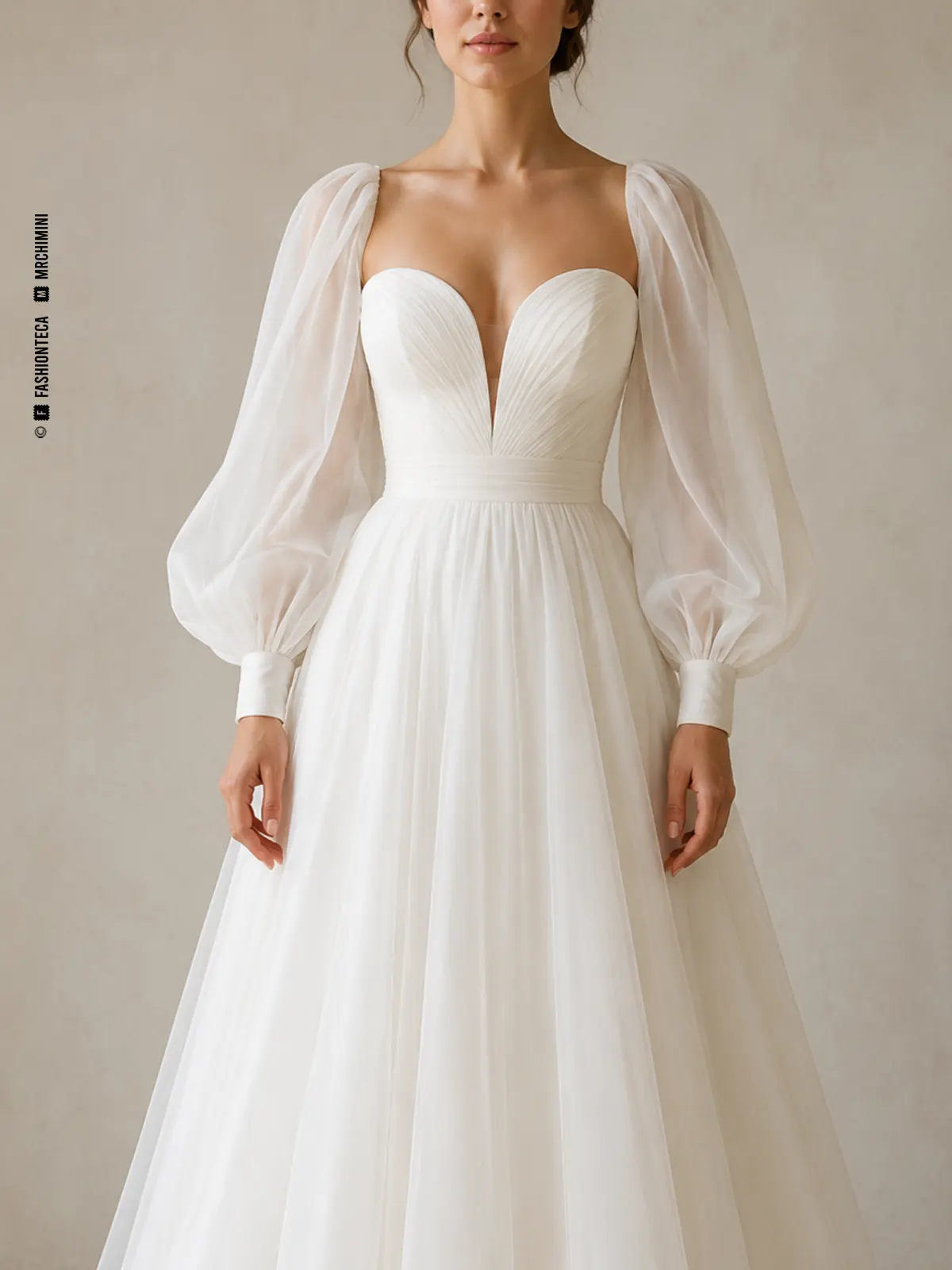 Vestido de novia marfil con manga nupcial globo, vista frontal de estudio.