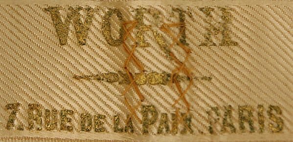 La etiqueta Worth: nombre, dirección y autoría