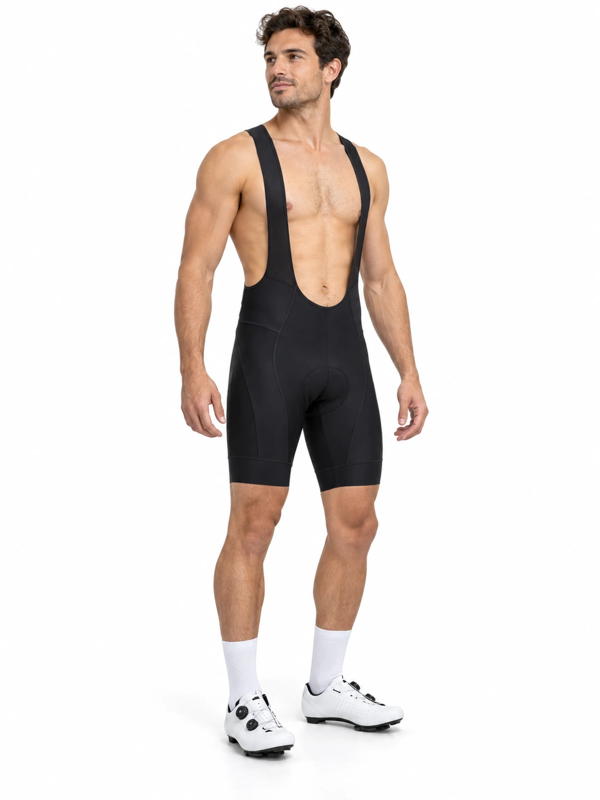 Persona adulta con culotte de ciclismo corto con tirantes, mostrando su silueta ajustada sobre fondo blanco.