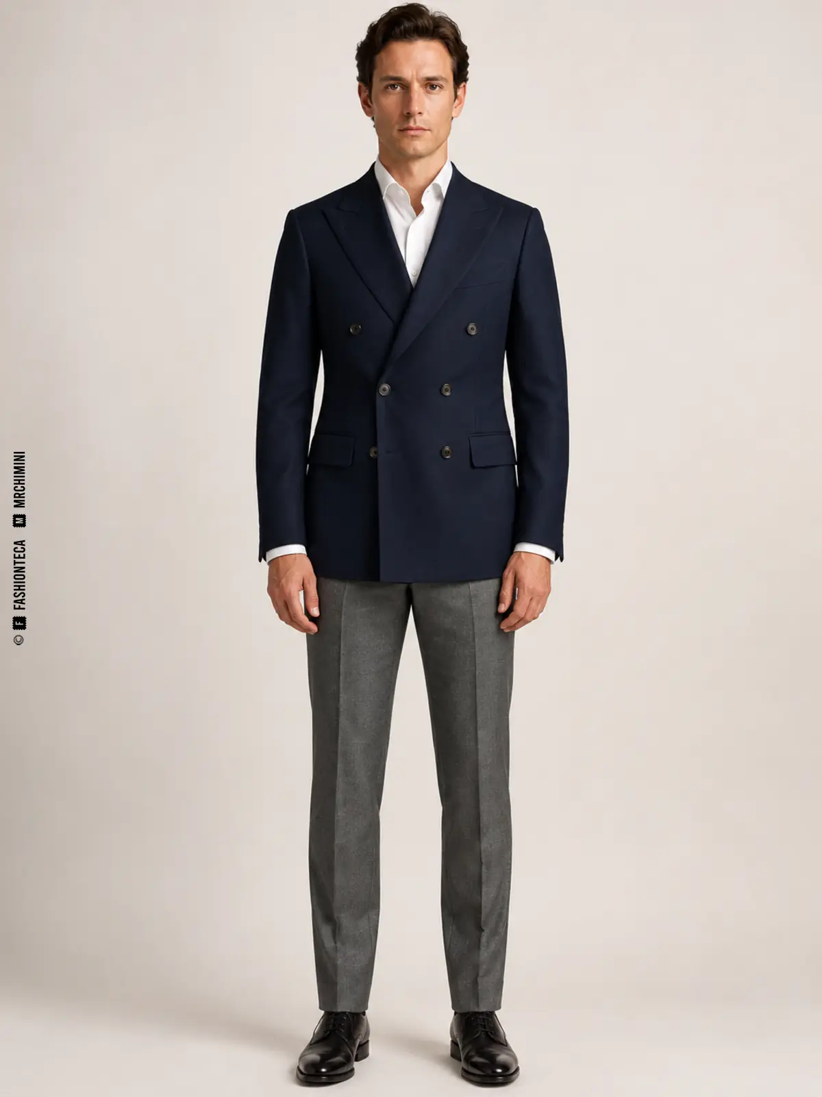 hombre con chaqueta cruzada azul marino de configuración seis por dos y pantalón gris